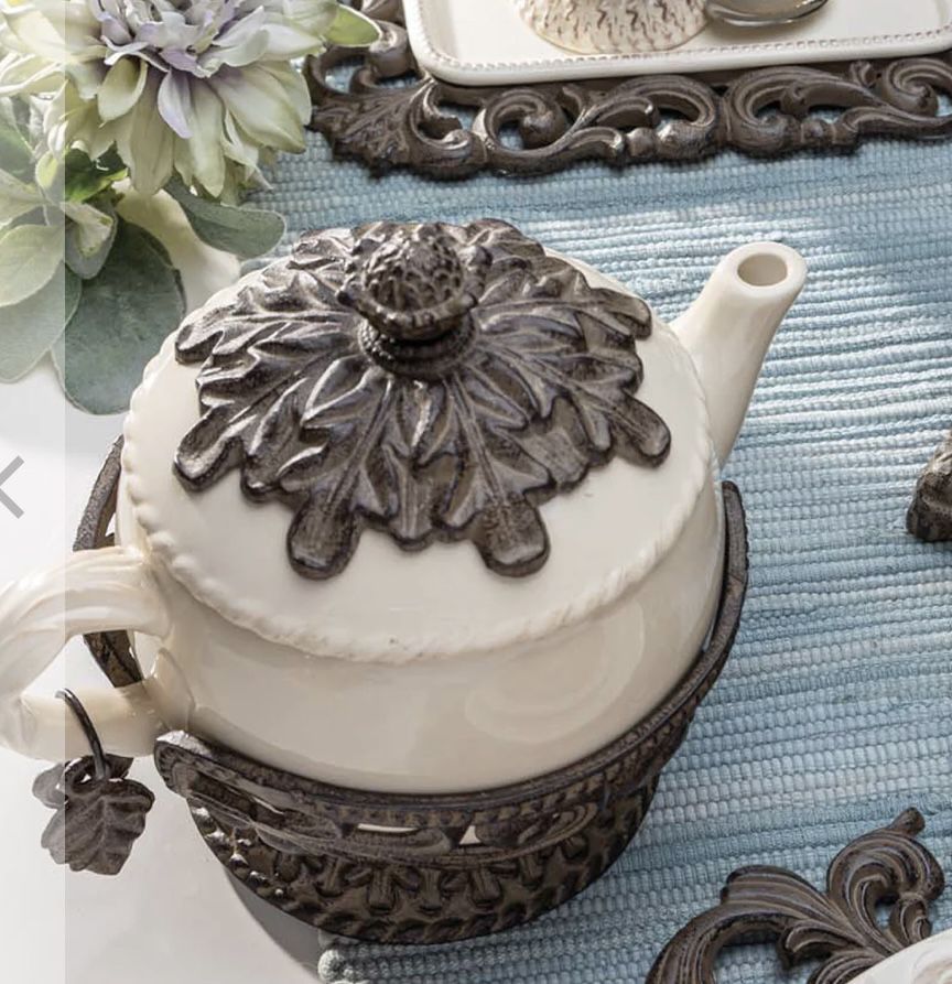 Cream Stoneware Teapot with Metal Acanthus Leaf Holder. -- Size: 9.5