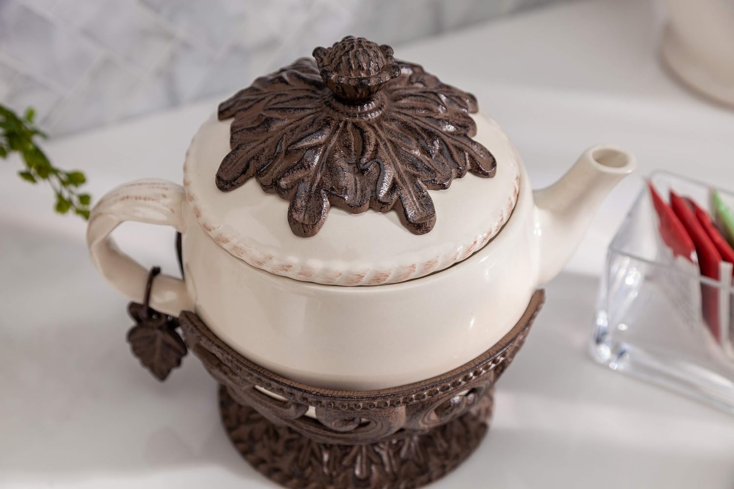 Cream Stoneware Teapot with Metal Acanthus Leaf Holder. -- Size: 9.5