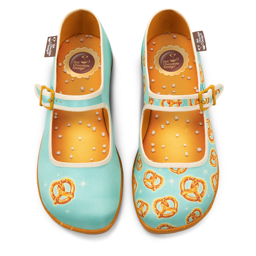 Pair of colorful shoes with pretzel pattern on a white background