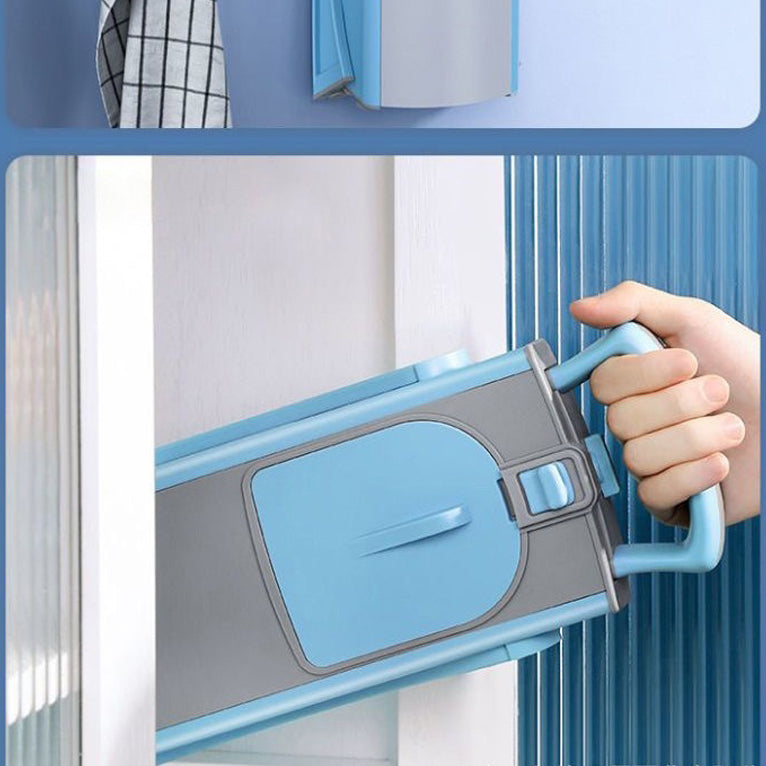 Hand using a blue and gray cleaning tool to clean a window.