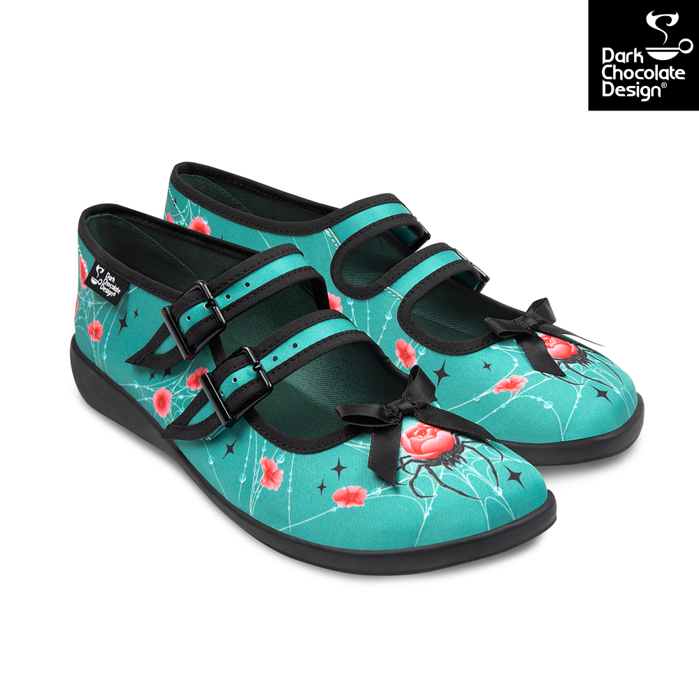 Pair of teal shoes with floral pattern and black straps on a white background, featuring Dark Chocolate Design logo.