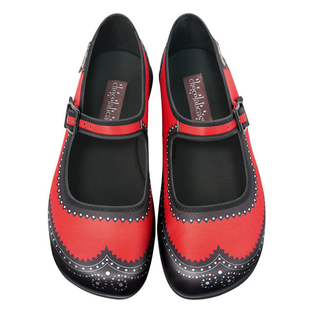 A pair of red and black brogue-style flats with a mary-jane upper and a cushioned sole.