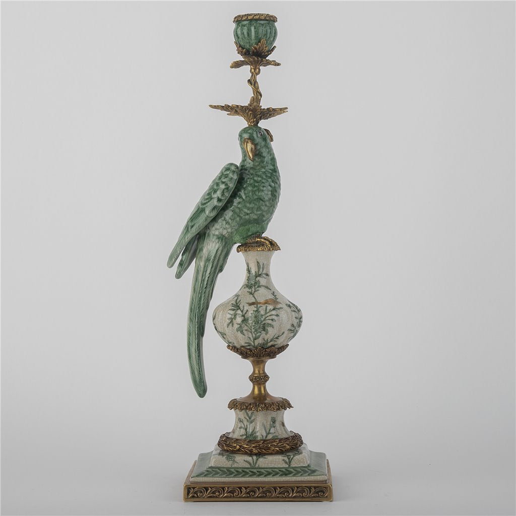 Decorative candle holder with a parrot figure on a gray background