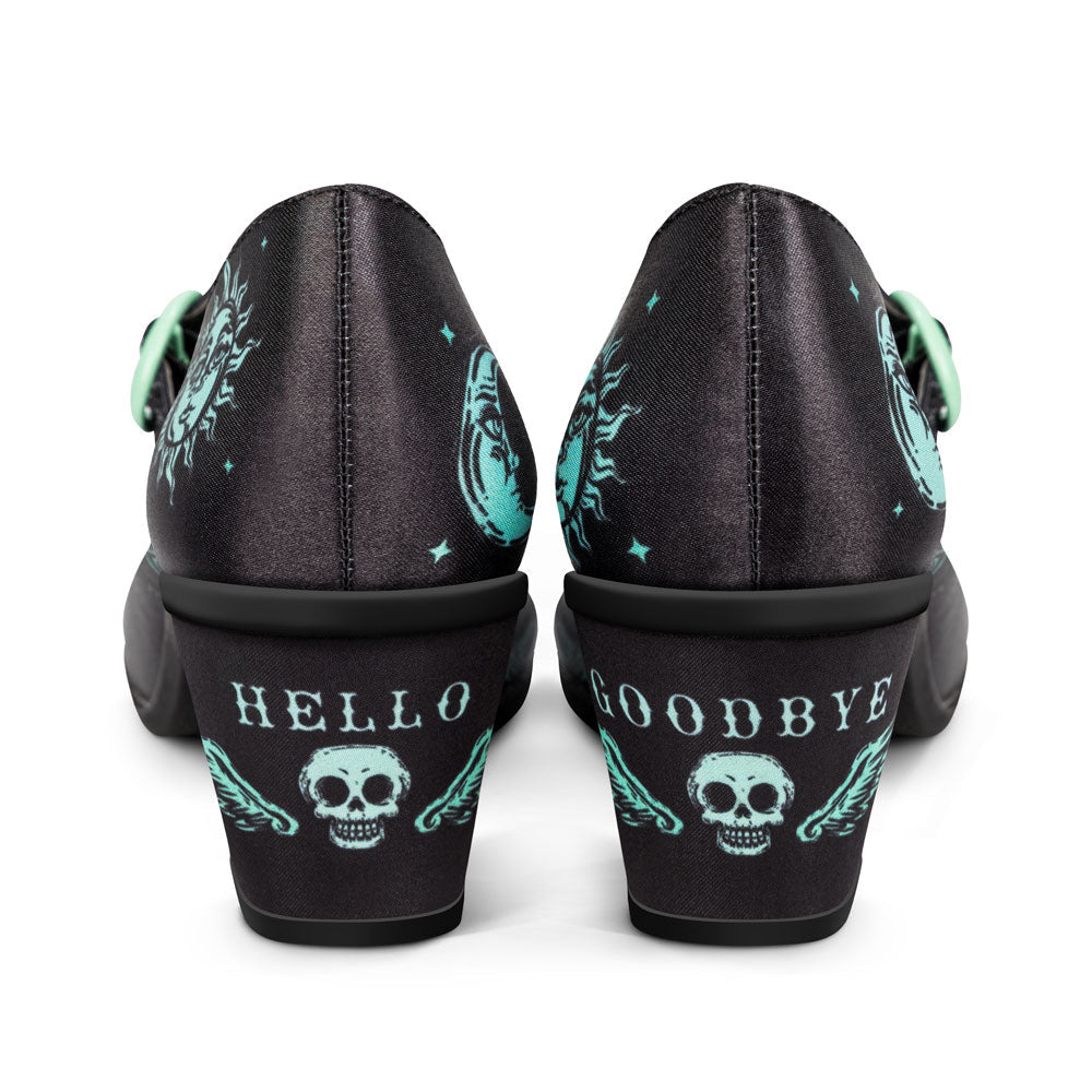 Black shoes with teal skull designs and 'Hello' and 'Goodbye' text on a white background
