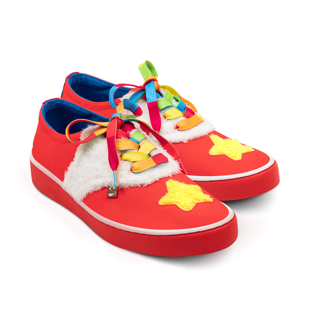 Red sneakers with colorful laces and star designs on a white background