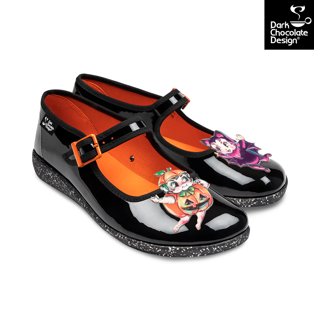 Black and orange shoes with cartoon character design on a white background, featuring Dark Chocolate Design logo.