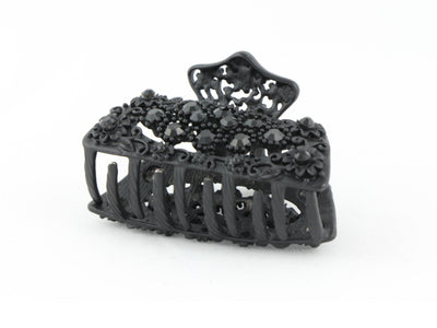 Black metal hair claw clip with black stones on a tiny floral pattern