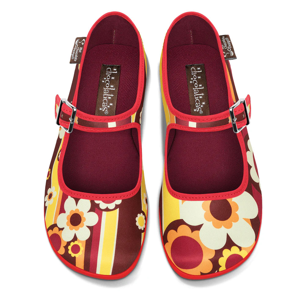 Colorful floral-patterned shoes with a red strap on a white background