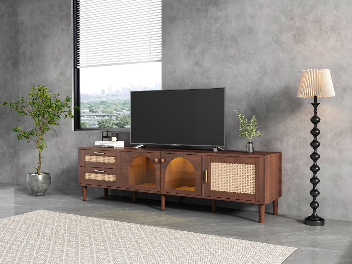 Wooden TV stand with a television in a modern living room setting.