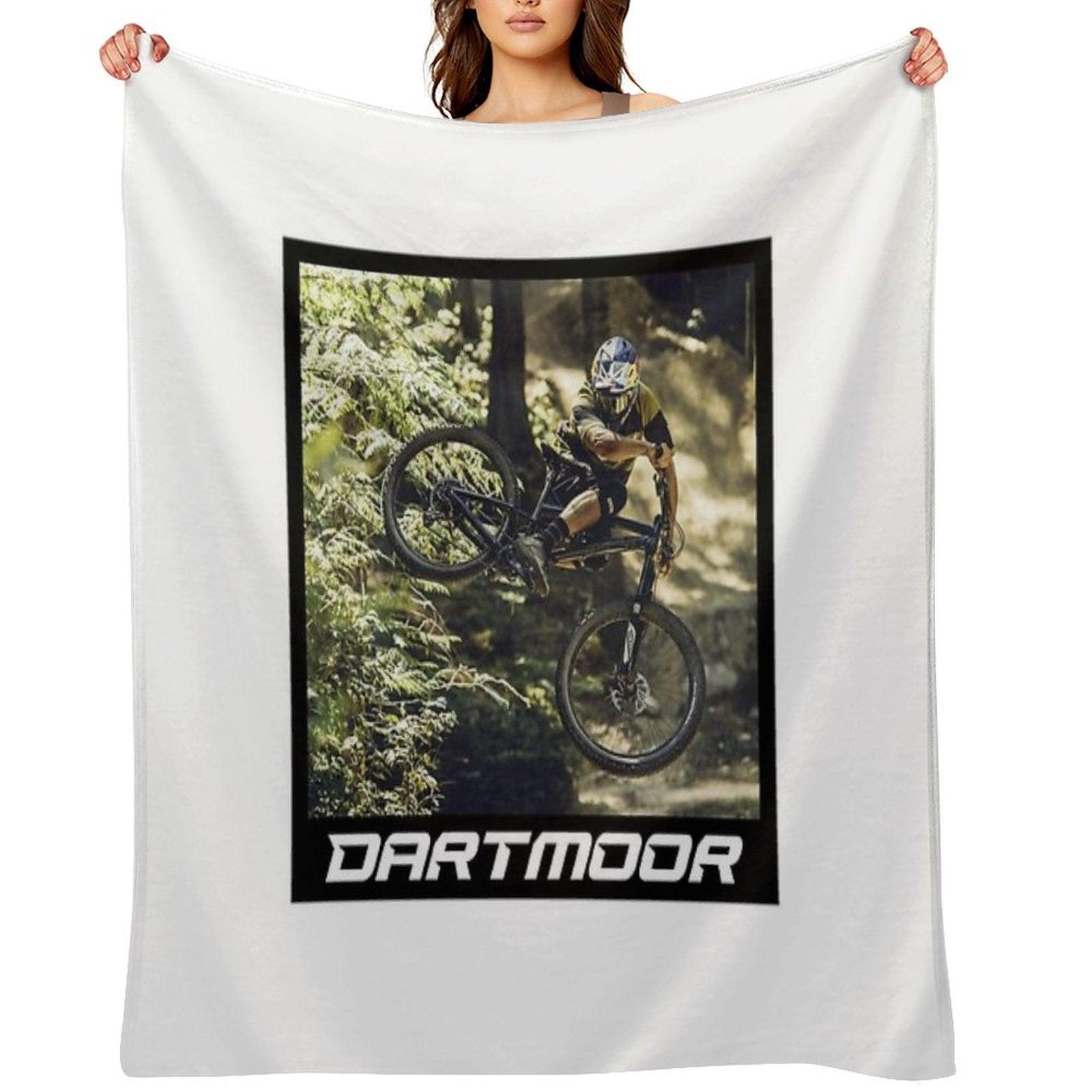 Cyclist Jumping with His Dartmoor Bikes Throw Blanket