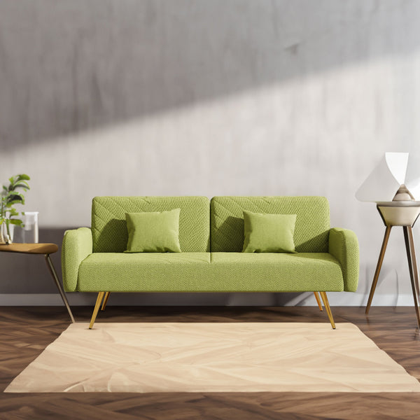 Green sofa with cushions in a modern living room setting