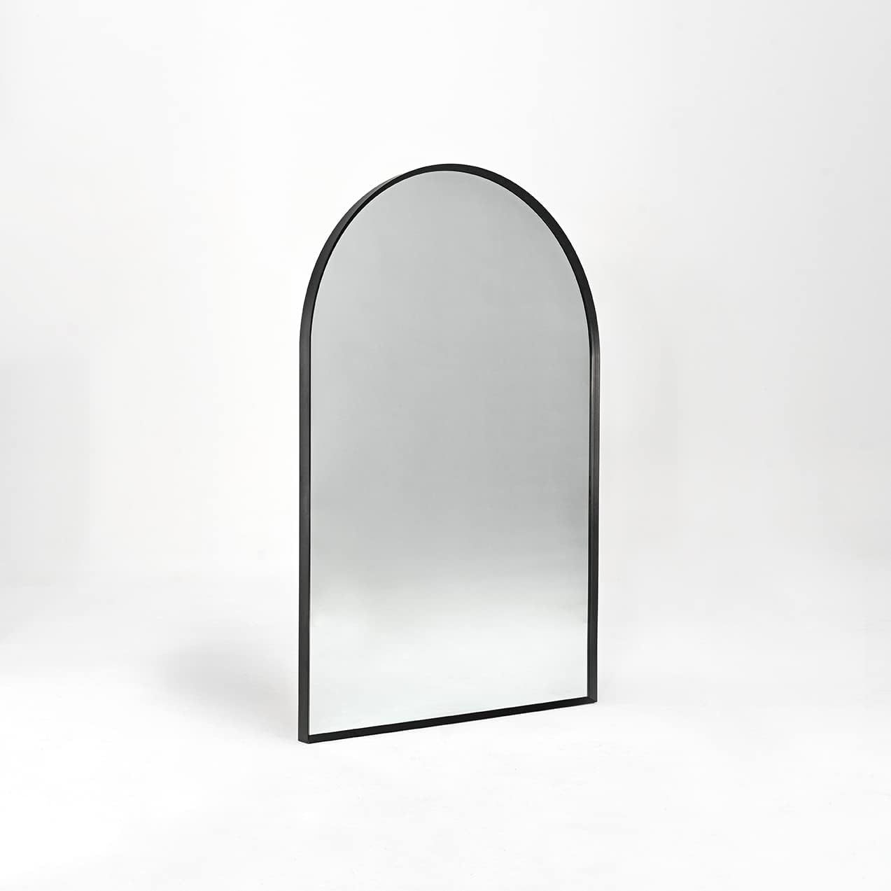 Angled side view of 24x36 Inch Black Metal Framed Arched Wall Mirror showing its slim profile and sturdy construction for versatile wall placement.