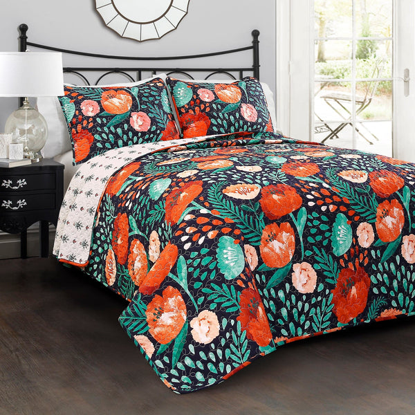 Floral and fruit patterned comforter set on a bed in a bedroom.