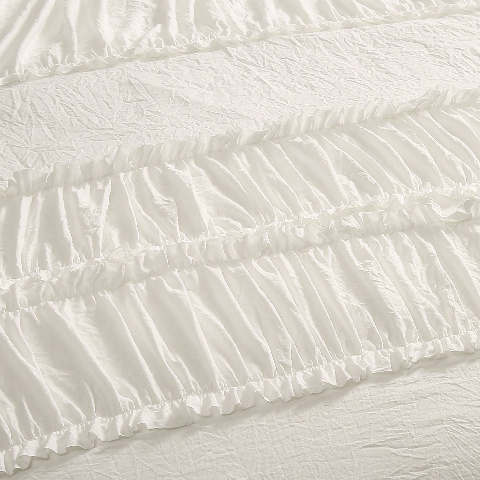 Close-up of textured white fabric with ruffled edge