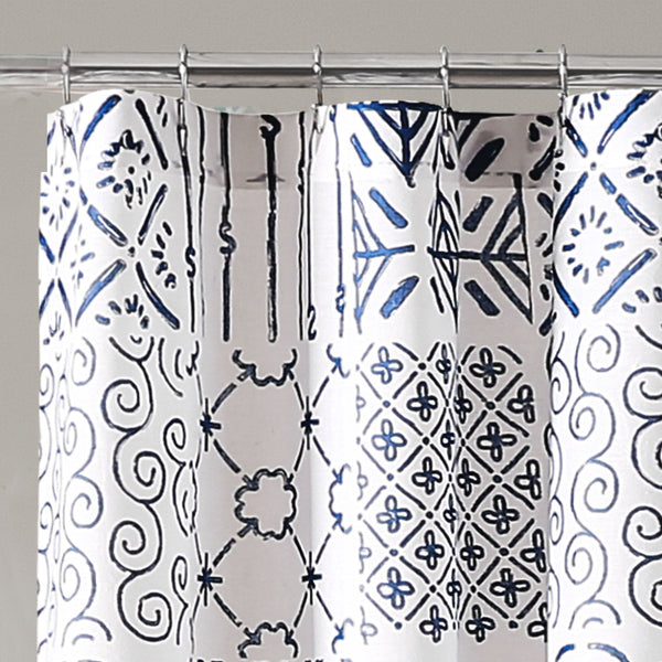 Shower curtain with blue and black geometric pattern on white background