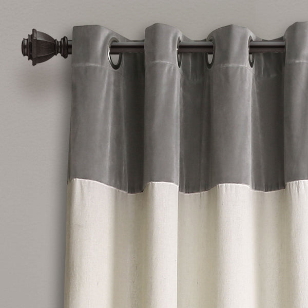 Gray and white striped curtain with a rod on a gray background