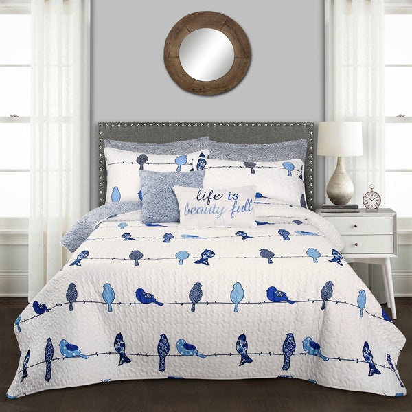 Bedding set with blue bird design in a bedroom setting