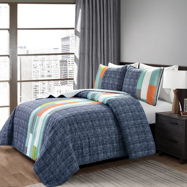 Bedroom with a bed covered in a blue quilt with colorful stripes, nightstand, and city view.