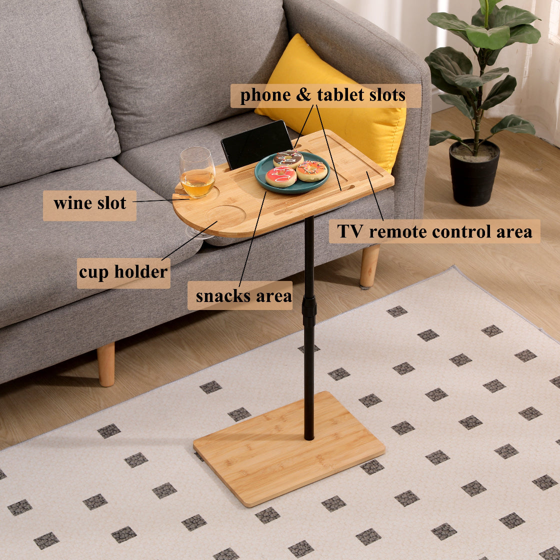 Labeled bamboo sofa table showing wine slot, cup holder, snack area, and device slots. Designed for organized couch-side use.