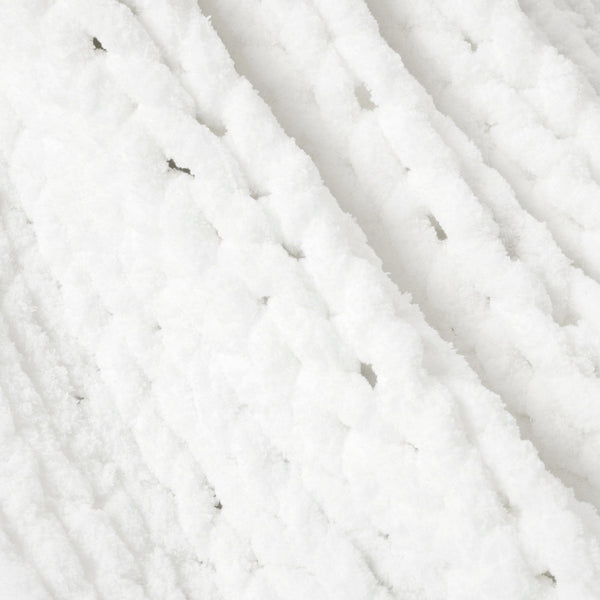 Close-up of white yarn with visible texture