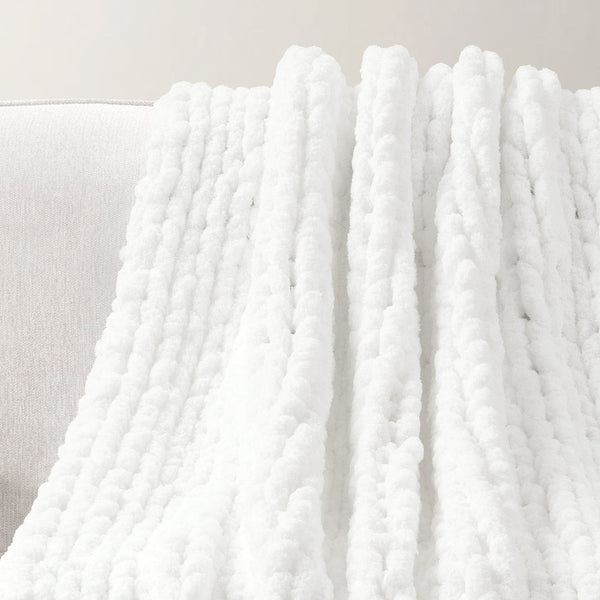 White textured blanket draped over a surface