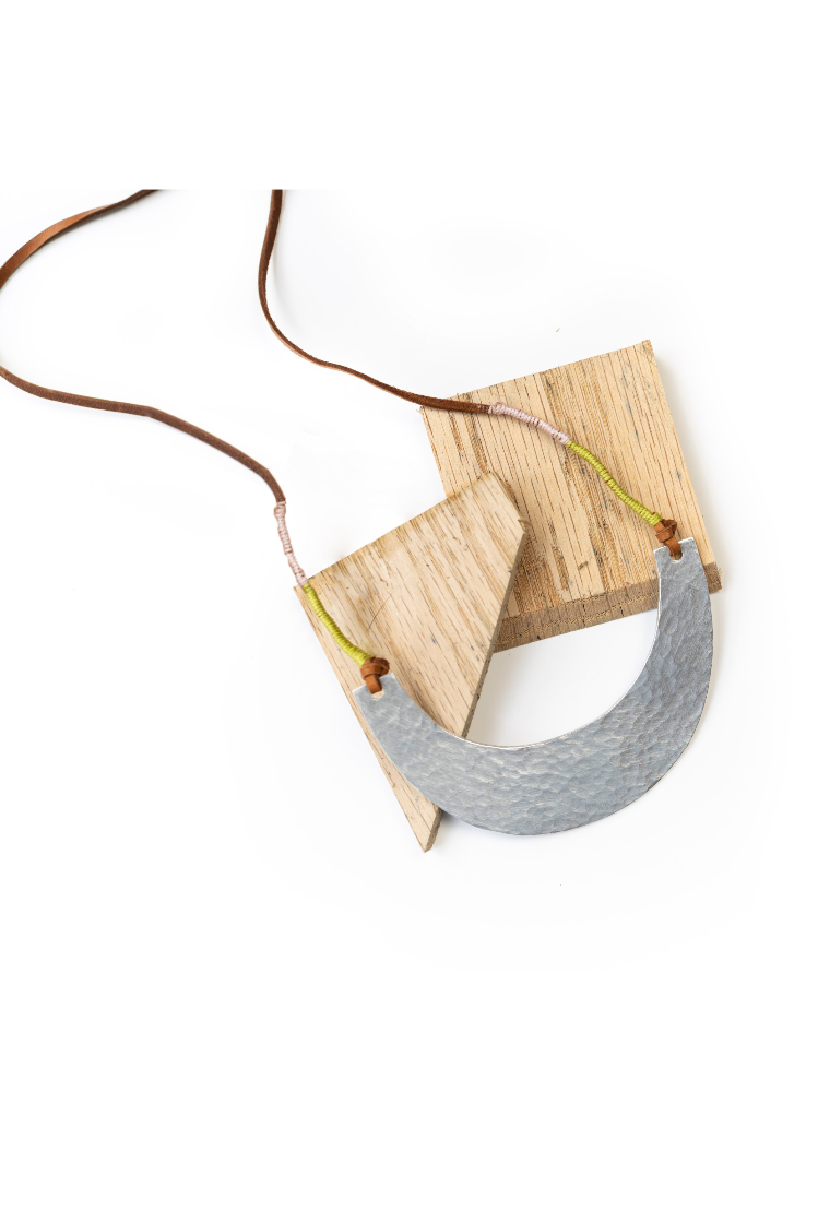 Necklace with a gray pendant on a white background