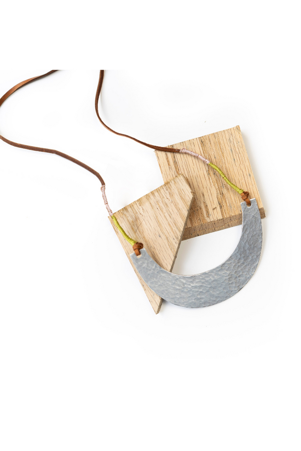 Necklace with a gray pendant on a white background