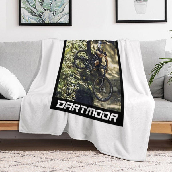 Cyclist Jumping with His Dartmoor Bikes Throw Blanket