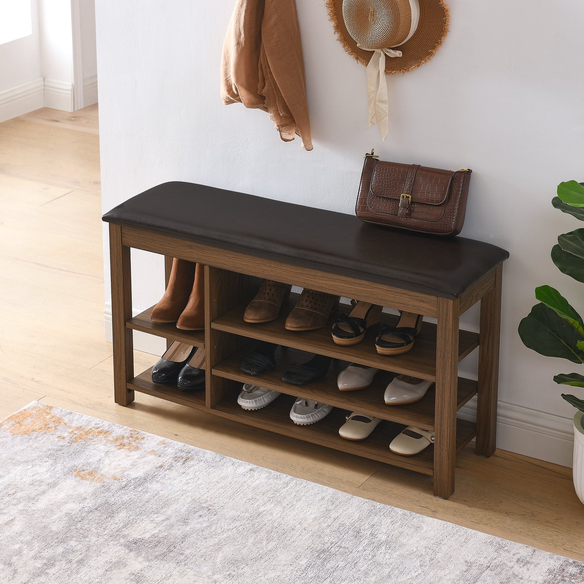 A height-adjustable long shoe-changing bench,made of natural rubberwood,comes with a comfortable seat,concealed storage space and large storage compartments. features natural wood grain.Brown