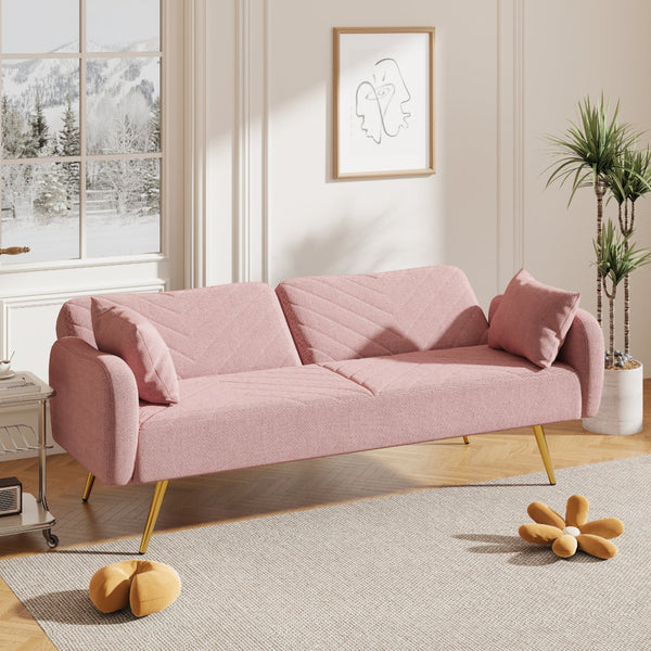 Pink sofa in a living room with a window and decorative items.