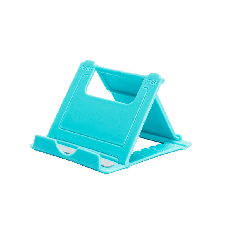 A plastic, foldable cradle for mobile phones