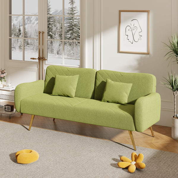 Green sofa in a living room with a window and decorative elements.