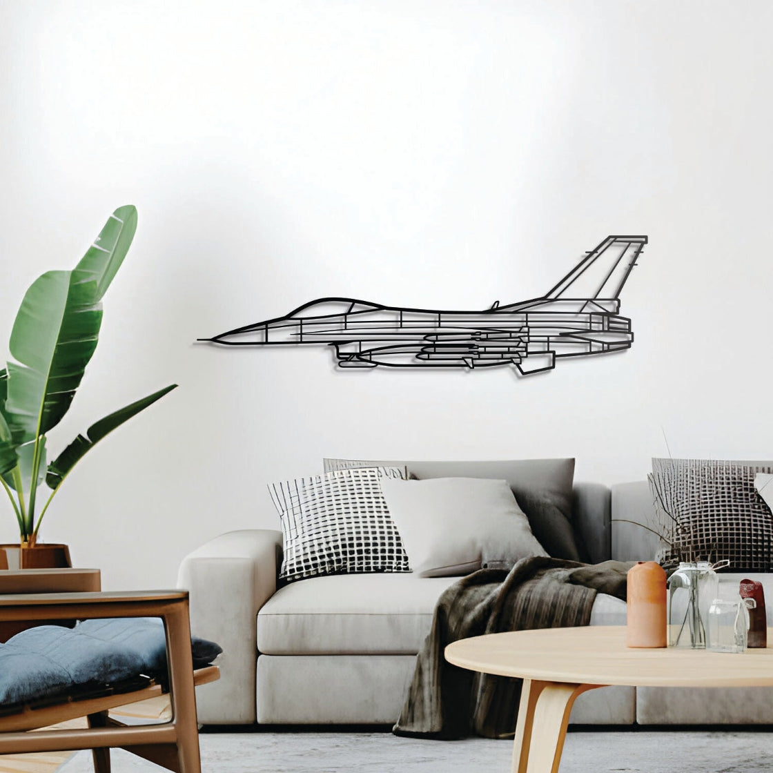 Modern living room with a gray sofa, decorative pillows, and a plant, featuring a black airplane wall decal.