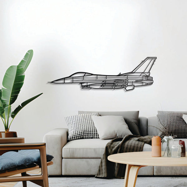 Modern living room with a gray sofa, decorative pillows, and a plant, featuring a black airplane wall decal.