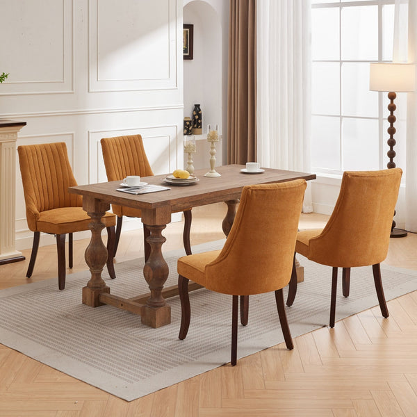 Dining room setup with four Rayon Cloth Flocking Linen Dining Chairs in mustard yellow around a wooden table on a beige rug.