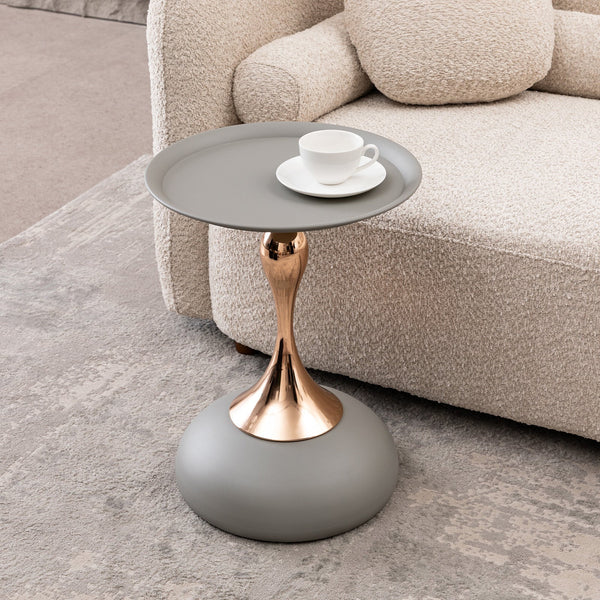 Mermaid Tail End Coffee Table Round Side Table placed beside a beige sofa, showcasing its stylish metal pedestal and functional tabletop.