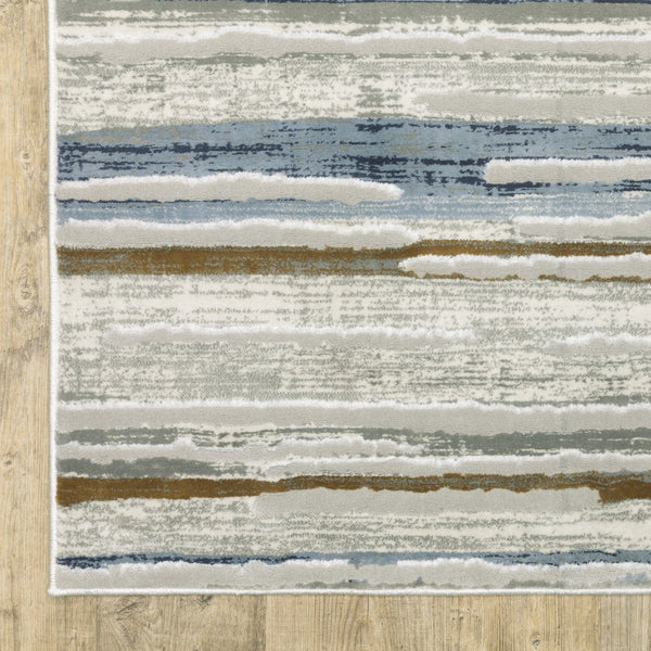 3' X 5' Grey Blue Ivory Brown Beige And Navy Abstract Power Loom Stain Resistant Area Rug