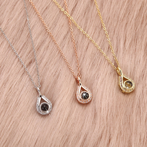 Waterdrop shaped fashion projection necklace with 100 languages. I love you. Color photos, customized lover accessories