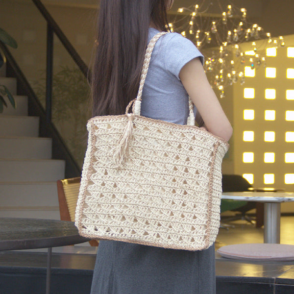 Square tassel single shoulder grass woven bag small fresh hollow handmade grass woven bag women's beach bag