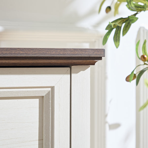 Corner detail of the Farmhouse 5 Drawers Dresser Chests for Bedroom showing the contrast between the dark top and white frame.