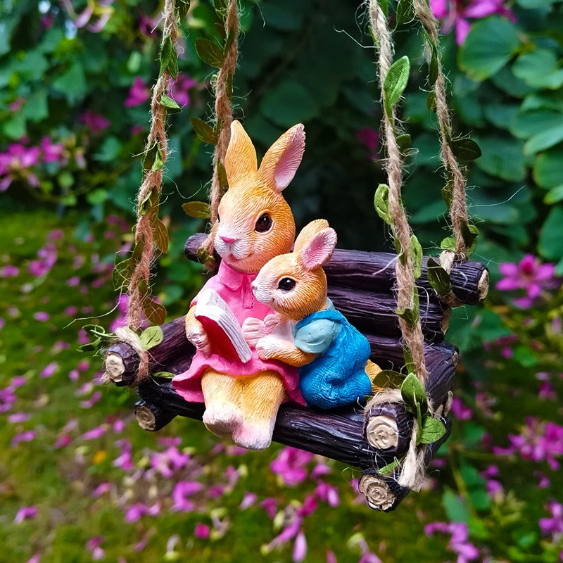 Simulated rabbit reading animal ornament