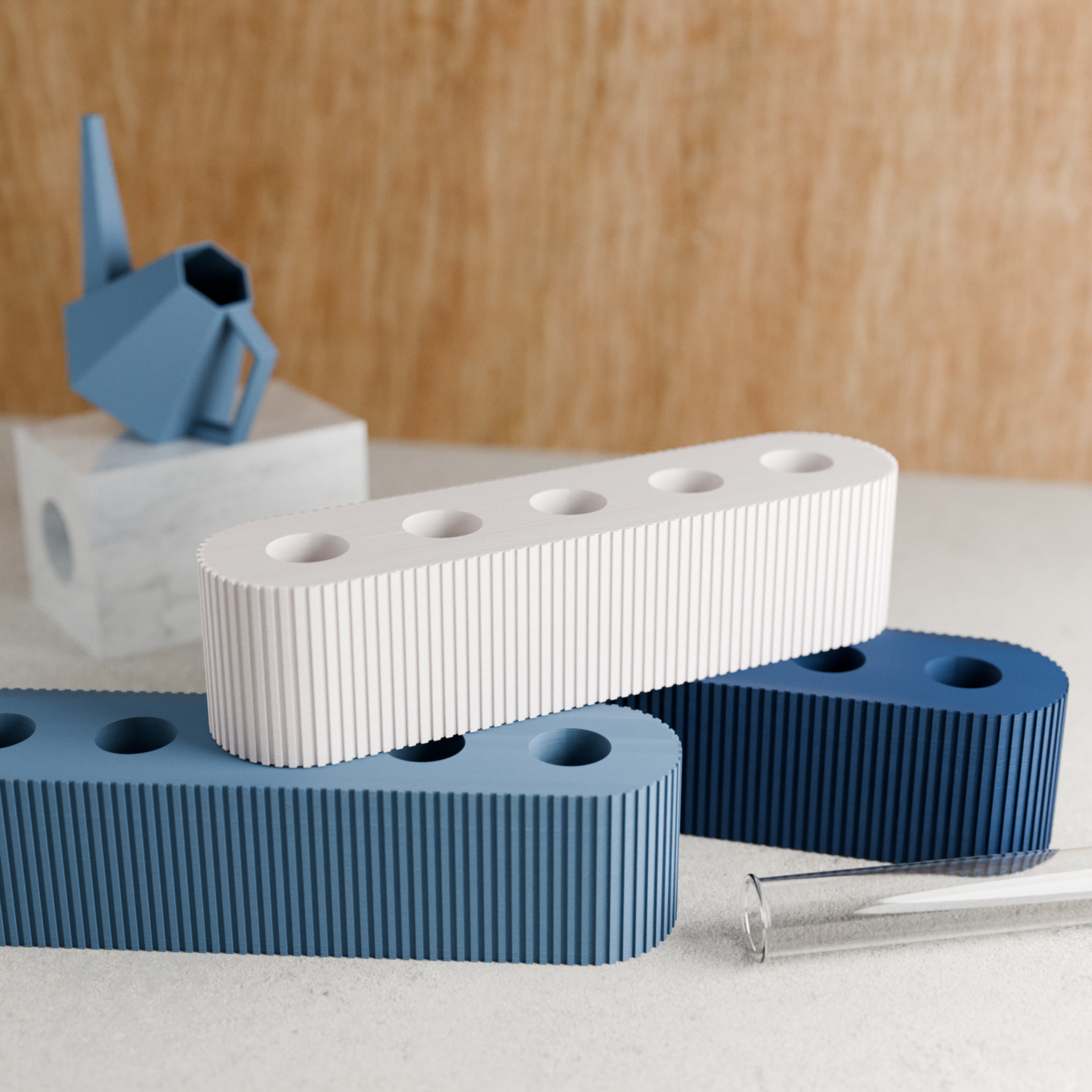 Set of blue and white geometric objects on a light wood background