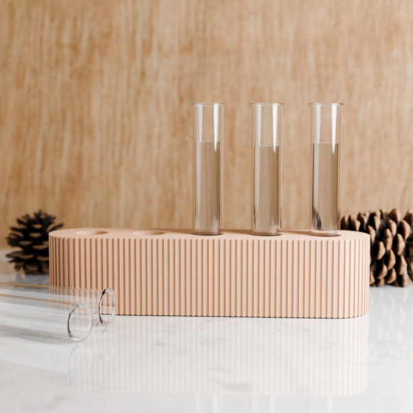 Three clear test tubes on a beige stand against a wooden background
