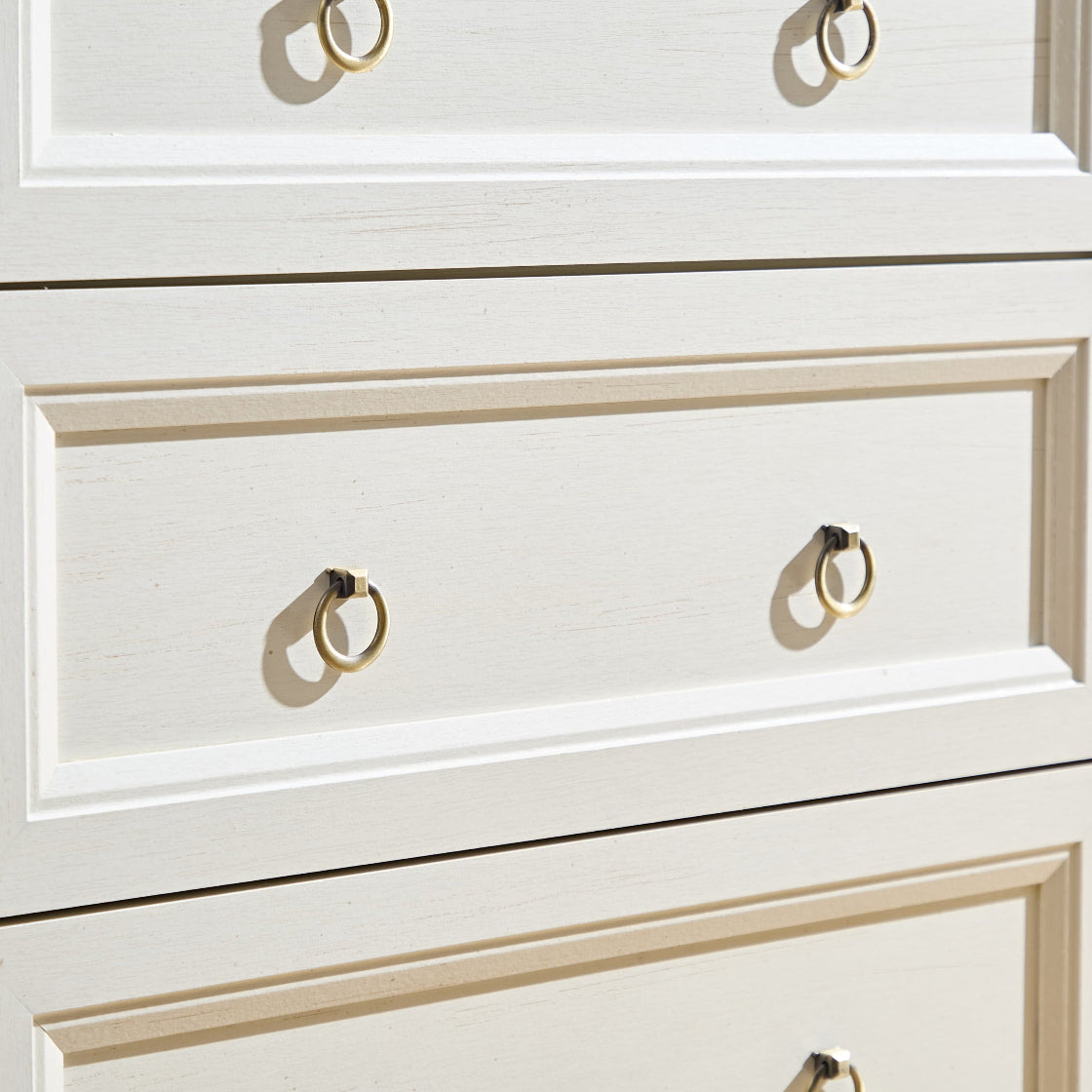 Close-up of drawer fronts on the Farmhouse 5 Drawers Dresser Chests for Bedroom, showing the textured white finish and vintage-style ring handles.