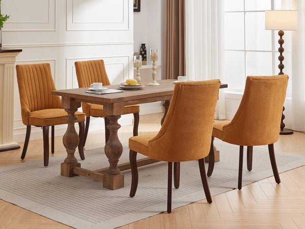 Four Rayon Cloth Flocking Linen Dining Chairs in mustard yellow around a wooden table in a bright, elegant dining space.