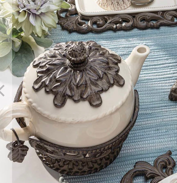 Cream Stoneware Teapot with Metal Acanthus Leaf Holder. -- Size: 9.5