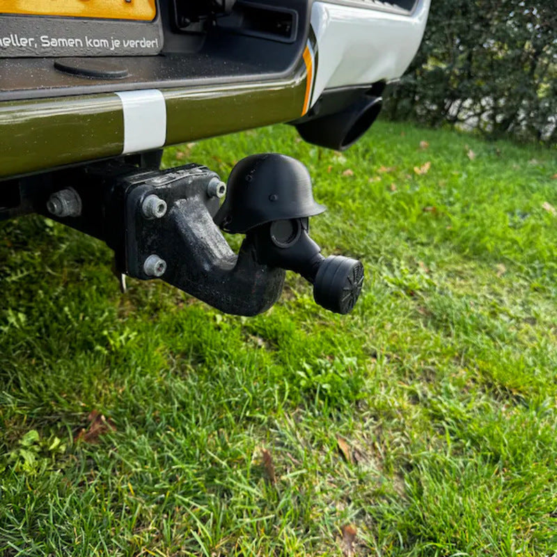 3D - printed trailer hitch cover with steel helmet and gas mask design. Protects the receiver tube from rusting.