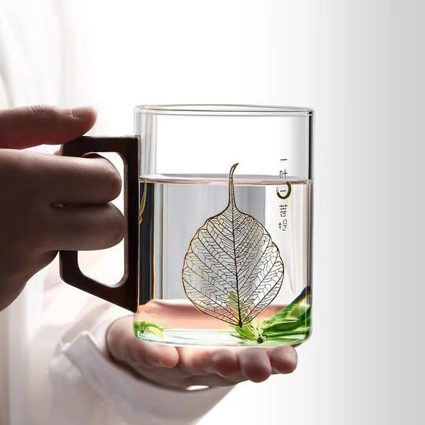 High end green tea cup with walnut handle and lid. High temperature resistant glass office drinking cup