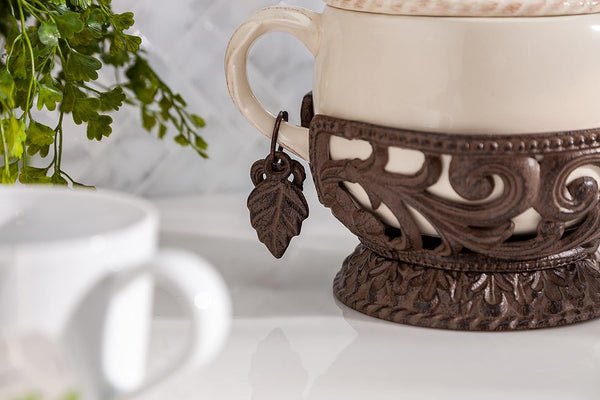 Cream Stoneware Teapot with Metal Acanthus Leaf Holder. -- Size: 9.5