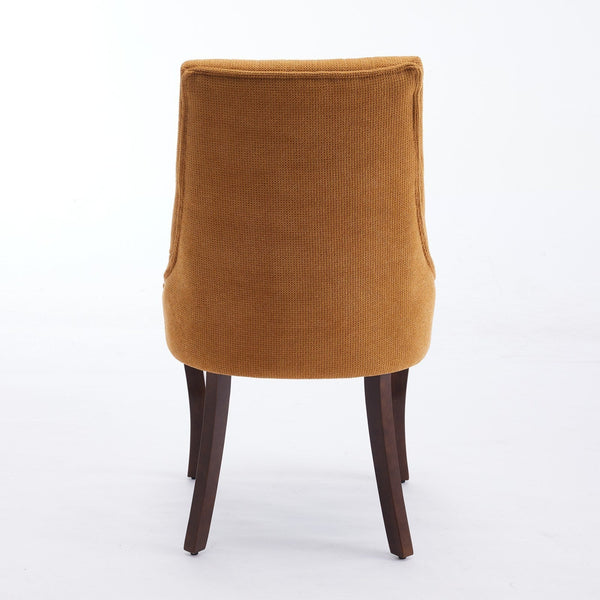 Back view of a chair from the Set of 2 Rayon Cloth Flocking Linen Dining Chairs with mustard yellow upholstery and curved design.